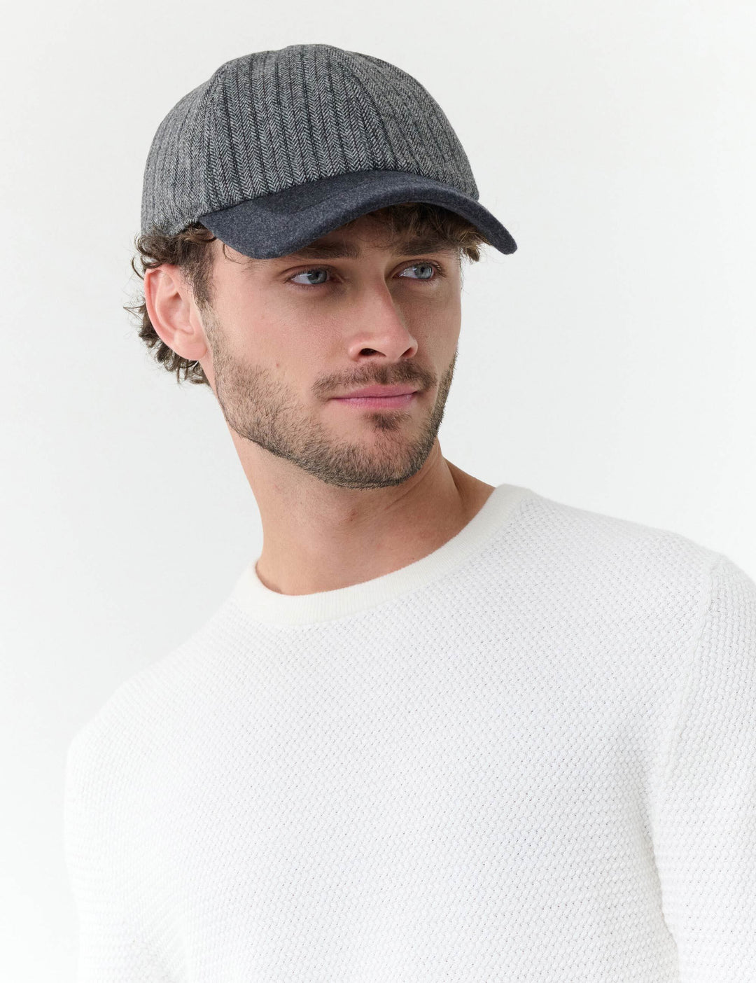 Winddichte bugatti Basecap mit Fischgrät-Design und Ohrenklappen