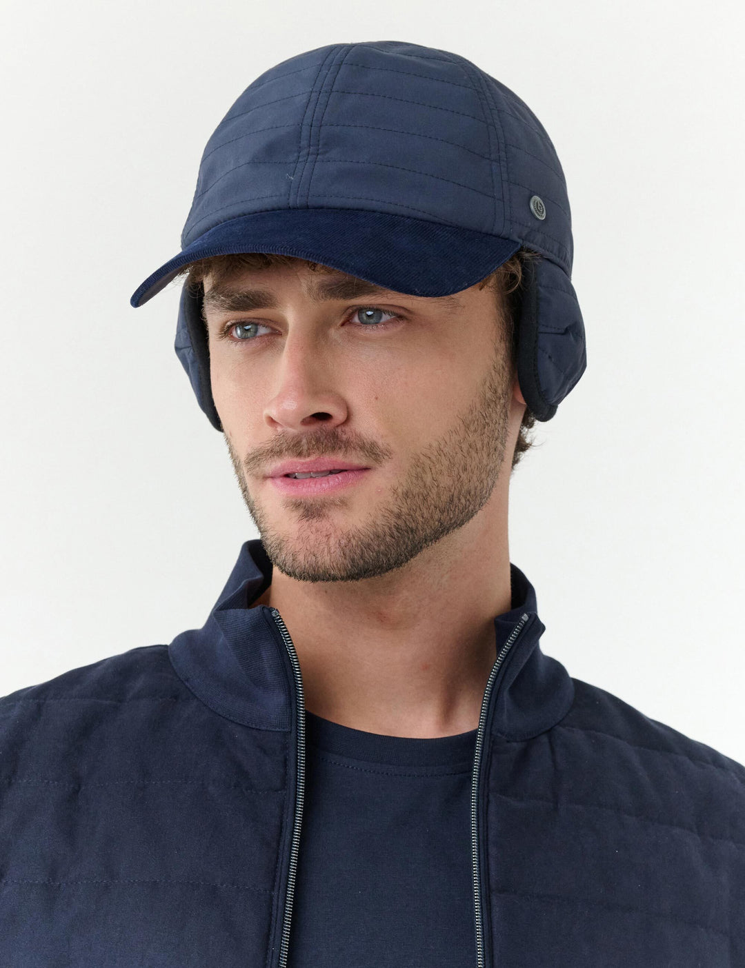 Winddichte bugatti Basecap in Stepp-Optik mit Ohrenklappen