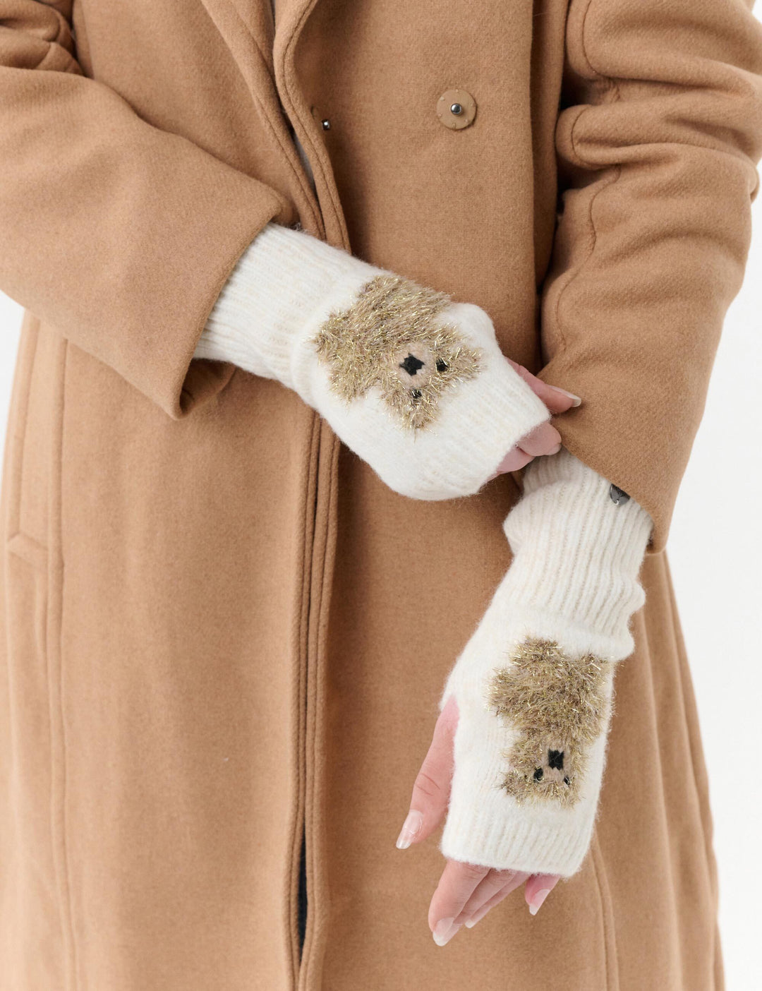 Handstulpen mit golden glitzerndem Teddy