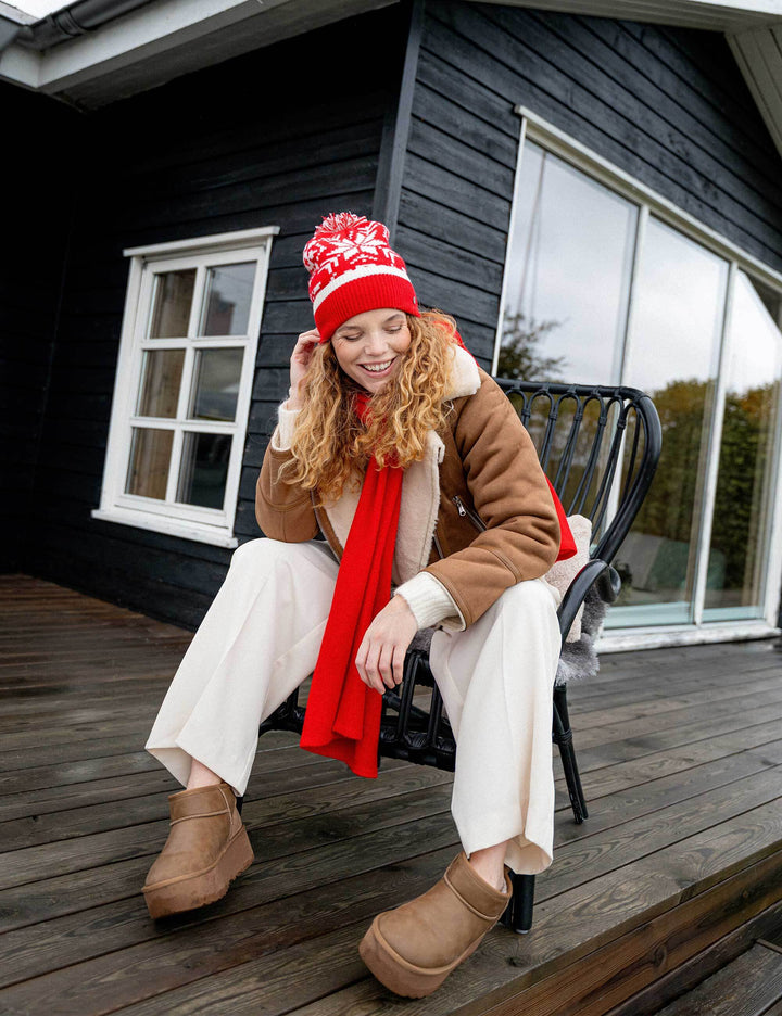 Strickmütze mit Sternen-Muster und Bommel aus reiner Wolle