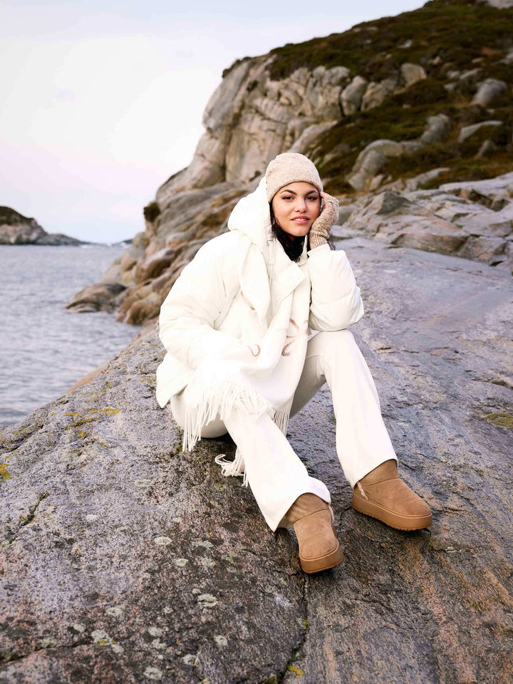 Gestrickte Stulpen mit Glitzer-Effekt