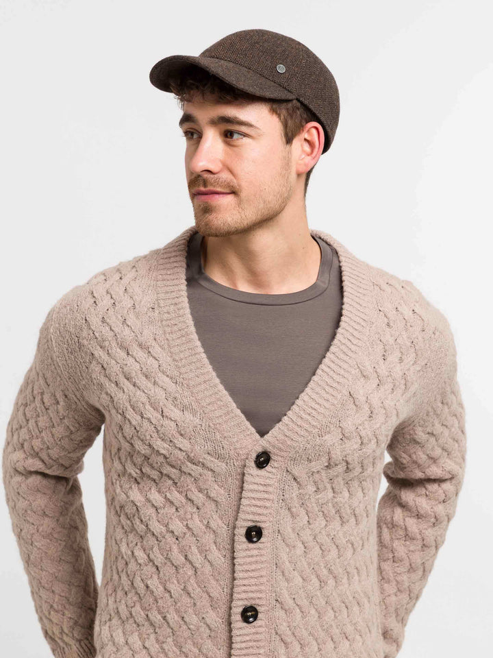 Wetterabweisende bugatti Flatcap mit Fischgrat-Design und Ohrenklappen