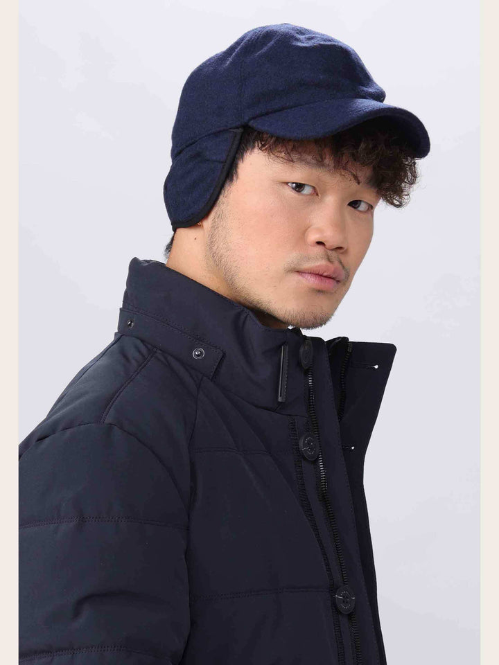 Einfarbige winterliche bugatti Basecap mit Ohrenklappen